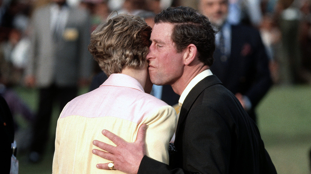 Prince Charles and Diana Spencer kissing