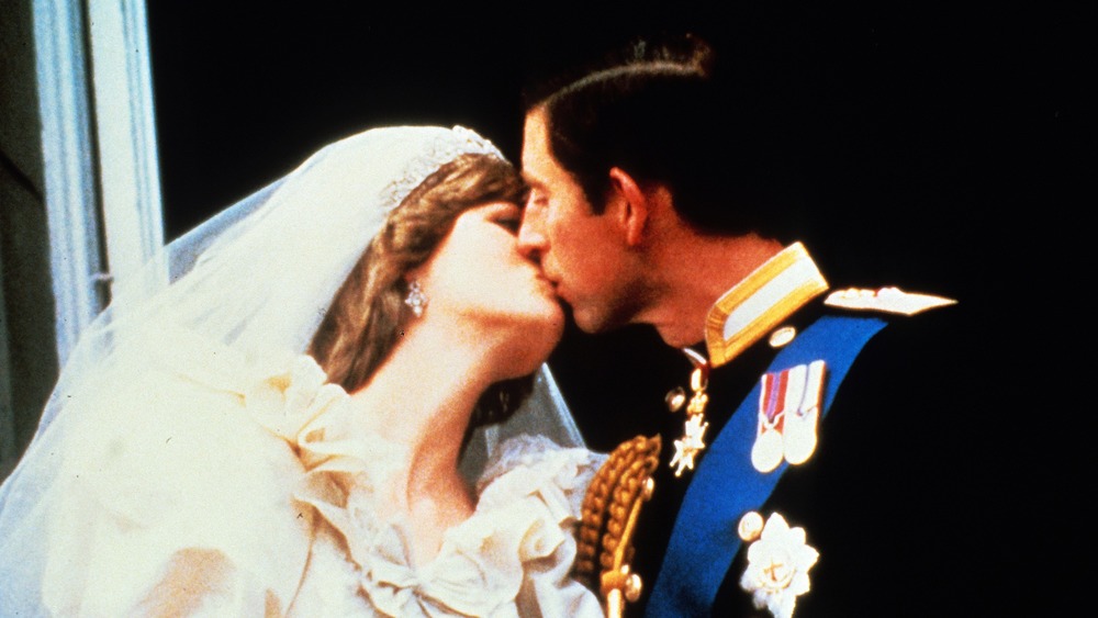 Prince Charles and Diana Spencer kissing at their wedding