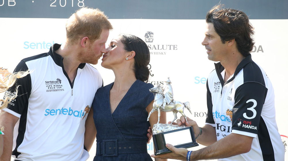 Prince Harry and Meghan Markle kissing