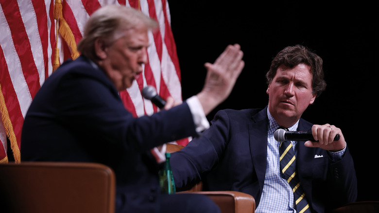 Trump and Tucker Carlson at an event in Phoenix