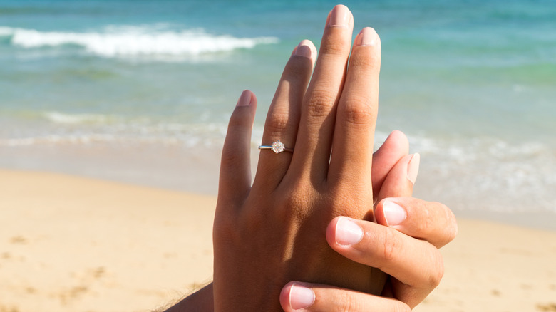 solitaire engagement ring at the beach