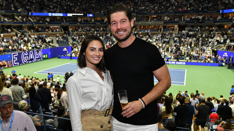 Paige Desorbo and Craig Conover posing at US open 