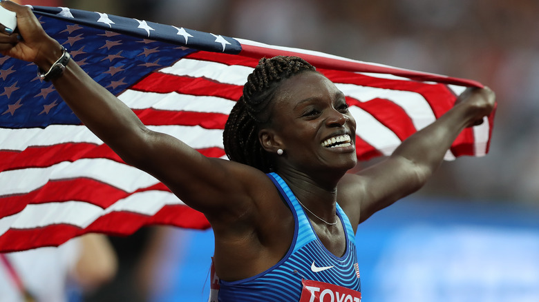 Dawn Harper-Nelson holding an American flag