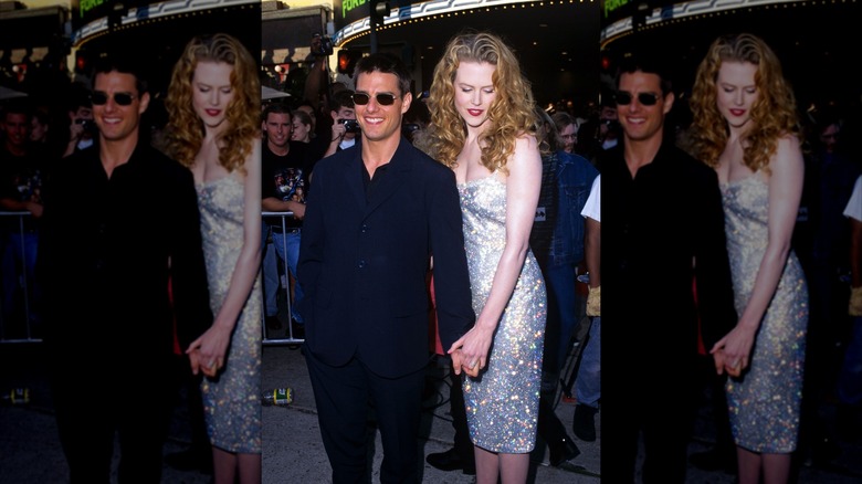 Tom Cruise and Nicole Kidman holding hands