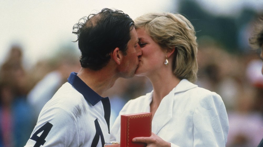 Princess Diana and Prince Charles sharing an epic royal kiss