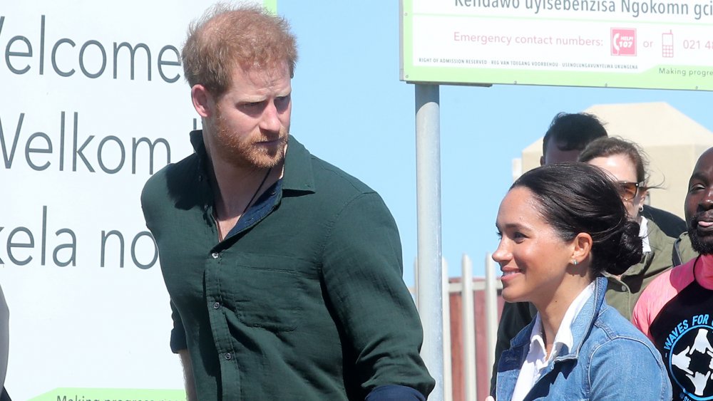 Meghan Markle and Prince Harry outside at an event