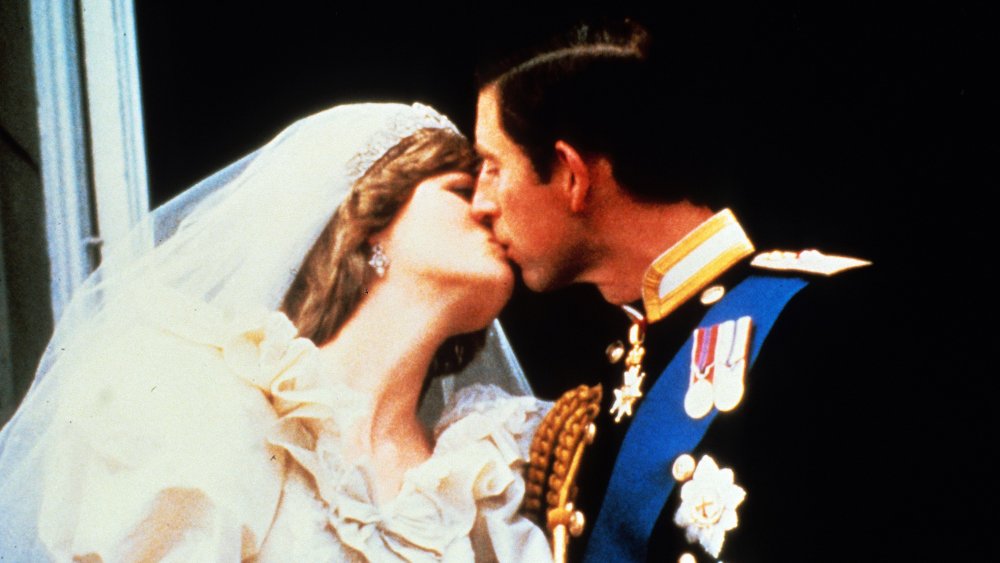 Princess Diana and Prince Charles sharing an epic royal kiss