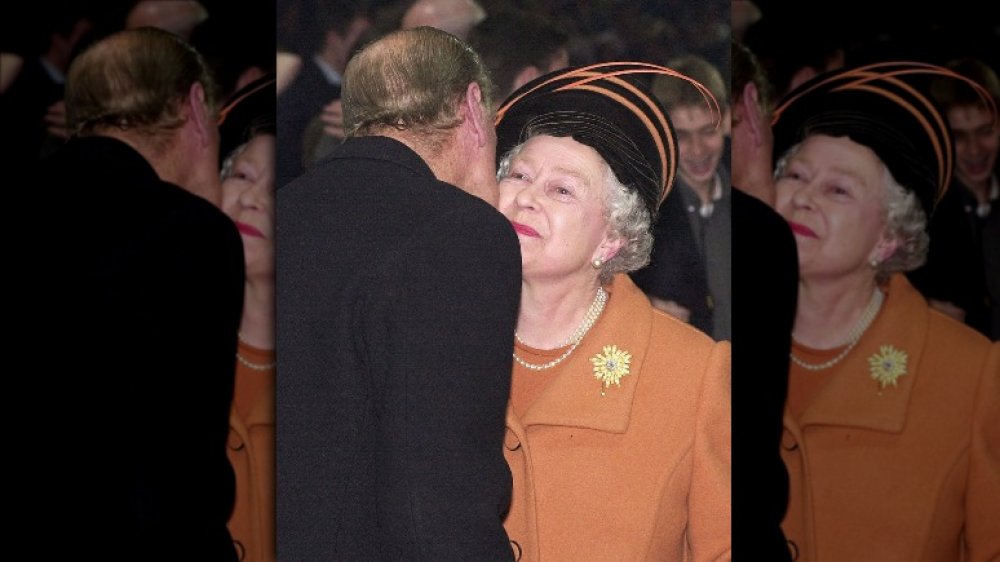 Queen Elizabeth and Prince Philip sharing an epic royal kiss