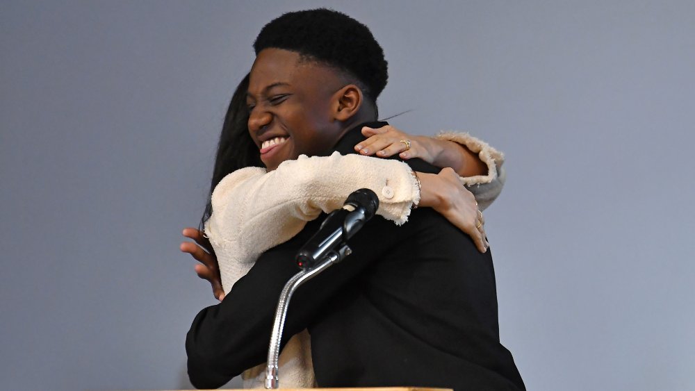 Meghan Markle hugging Aker Okoye