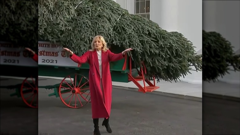 Jill Biden waving in red coat