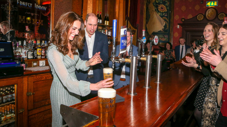 Kate Middleton pouring beer