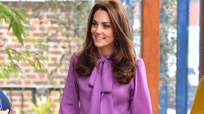 Kate Middleton wearing a purple blouse