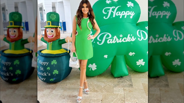 Kimberly Guilfoyle wearing green dress and silver heels