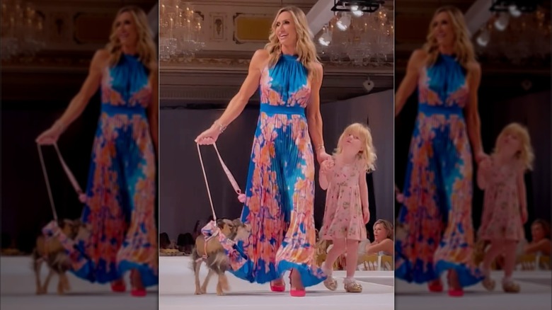 Lara Trump catwalks with a dog and her daughter