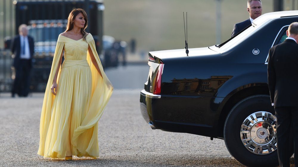 Melania Trump wearing a yellow chiffon dress