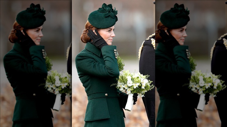 Kate Middleton smiling and carrying a bouquet