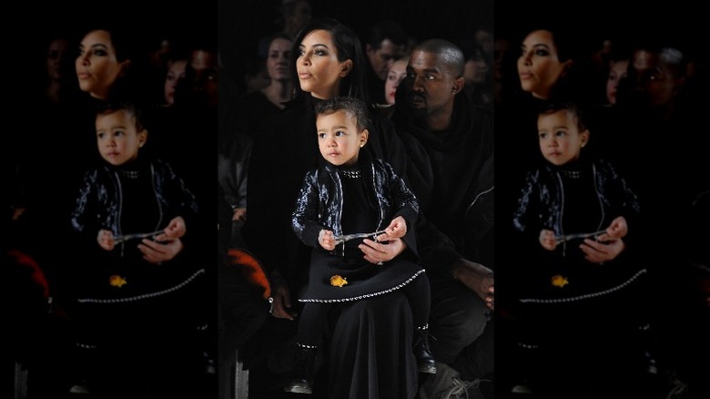 North West with parents at fashion show