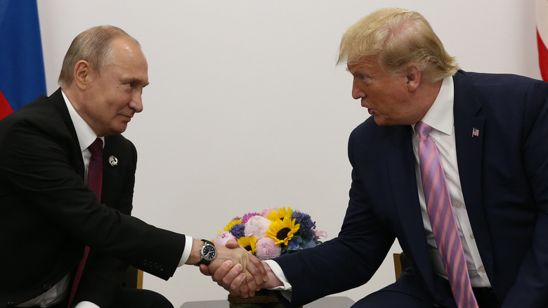 Vladimir Putin and Donald Trump shaking hands