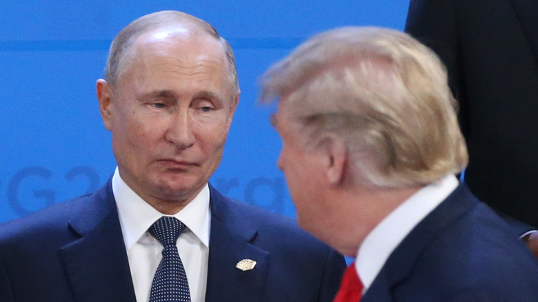 Vladimir Putin looking at Donald Trump