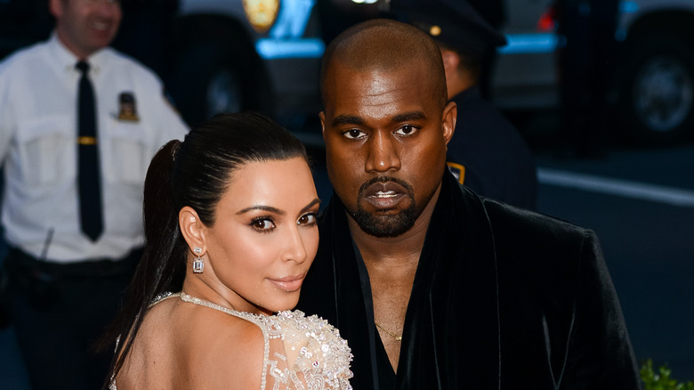 Kanye West and Kim Kardashian attending an event