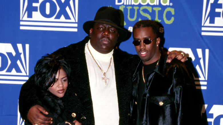 Lil Kim and Biggie at an event with Sean Combs