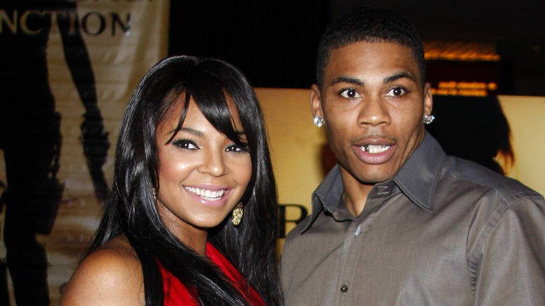 Nelly and Ashanti attending an event