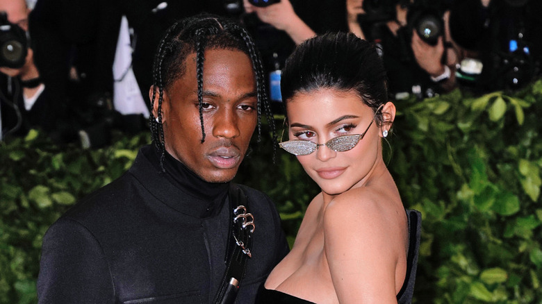 Travis Scott and Kylie Jenner attending an event