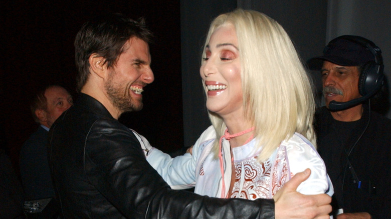 Tom Cruise Cher embracing laughing