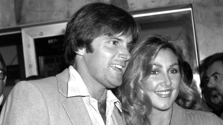 A young Caitlyn Jenner smiling with Linda Thompson