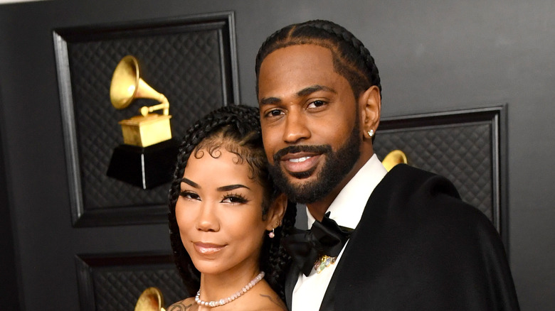 Big Sean posing with Jhené Aiko