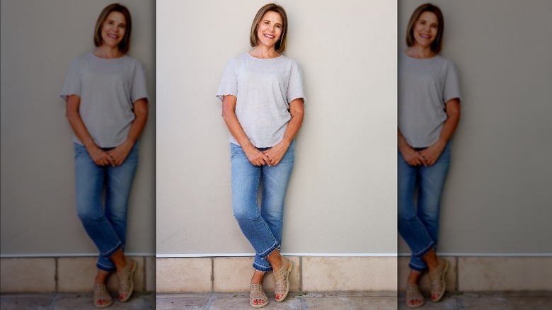 woman smiling wearing jeans