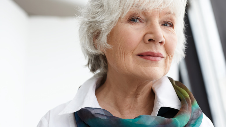 older woman wearing scarf