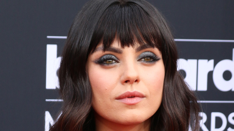 Mila Kunis with choppy bangs