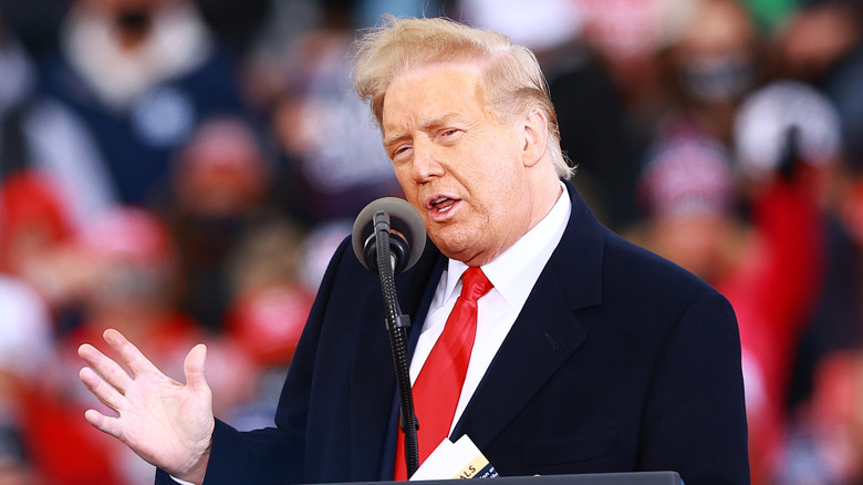 Donald Trump's hair blowing in the wind during speech