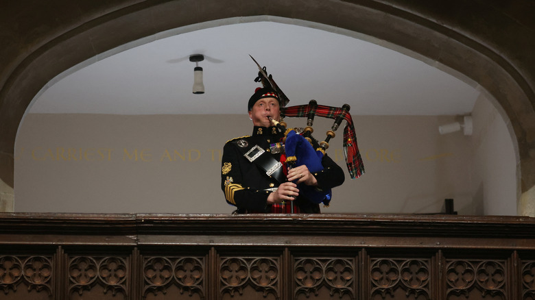 Piper plays during the queen's funeral