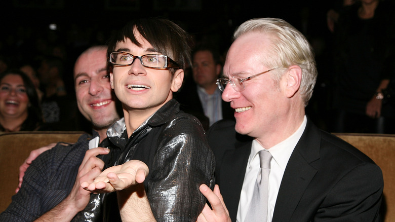 Christian Siriano smiling next to Tim Gunn