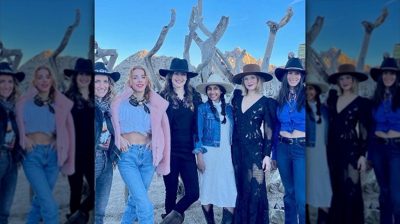 Kristen Bell surrounded by friends in the desert