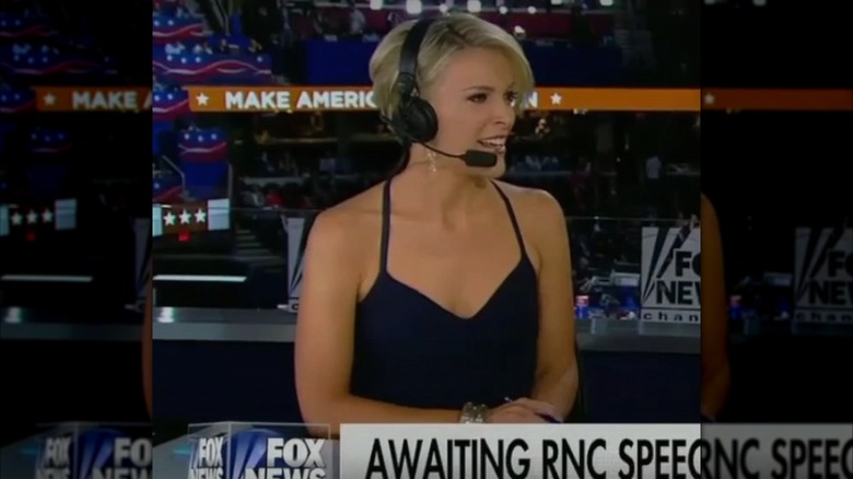 Megyn Kelly talking and smiling with revealing black dress