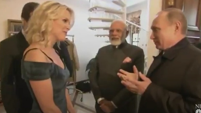 Megyn Kelly looking attentive while talking to Vladimir Putin