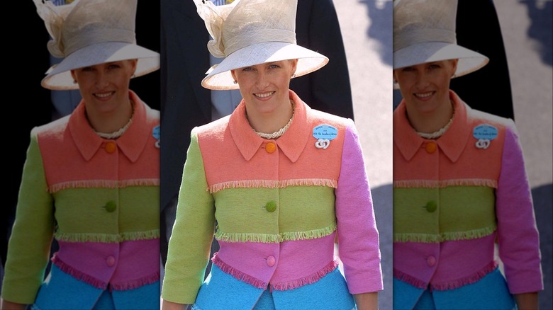 Sophie smiling in colorful suit