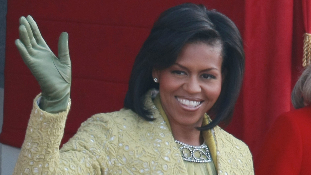 Michelle Obama waving to a crowd 