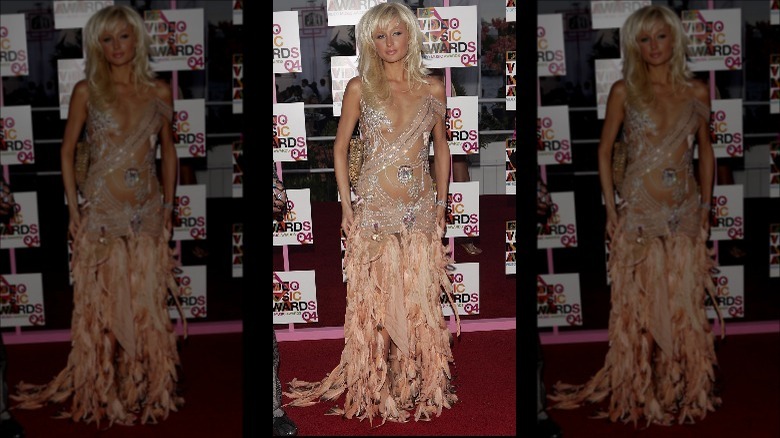 Paris Hilton wears a barely-there nude feather dress at the VMAs