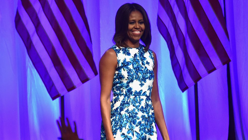 Michelle Obama showing her arms in a sleeveless dress