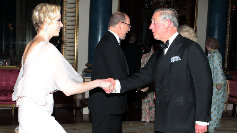 Princess Charlene curtsies to King Charles III