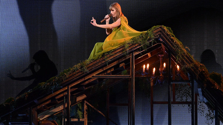 Taylor Swift performing on roof at the Eras Tour