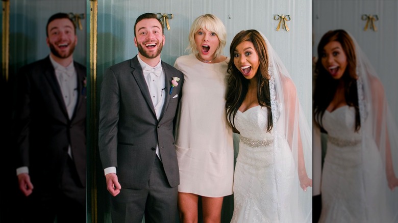 Taylor Swift posing with couple on wedding day