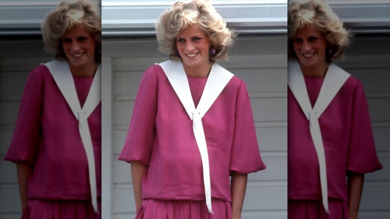 Pregnant Princess Diana smiling in pink dress