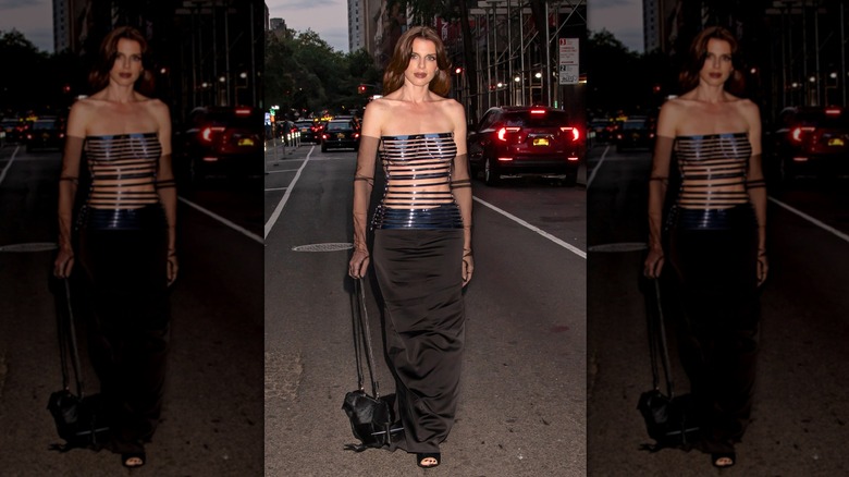 Julia Fox holding a bag designed to look like a bird