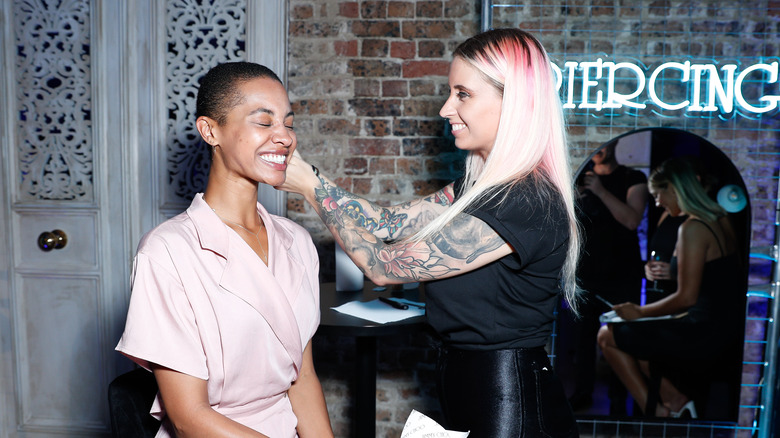 Woman getting pierced