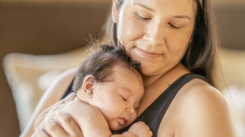 mother holding a baby